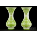 A pair of Baccarat acid etched cameo glass vases, trumpet form on bulbous base, cut with foliate