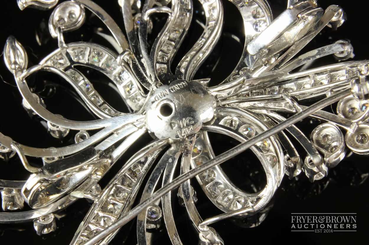 A 1950s diamond and white gold spray brooch/pendant, the bouquet scroll set throughout with - Image 5 of 7