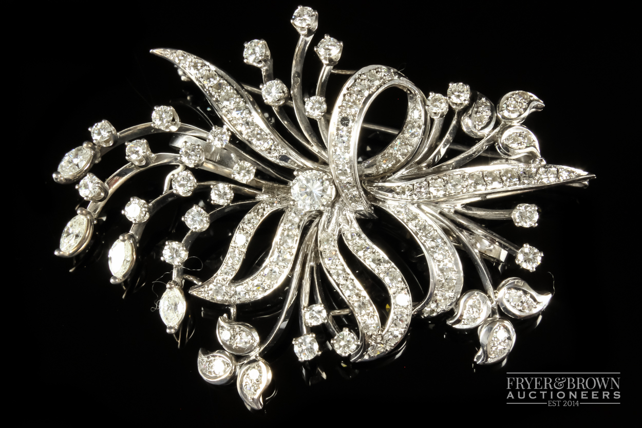 A 1950s diamond and white gold spray brooch/pendant, the bouquet scroll set throughout with - Image 2 of 7