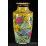 A Chinese famille rose enamelled baluster vase, decorated with a bird, peony and rockwork, 30cm