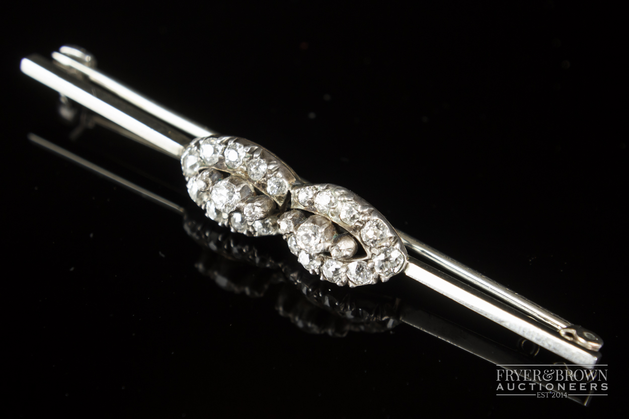 A diamond cluster bar brooch, c1915, the white gold bar pin set to the centre with two marquise - Image 2 of 4