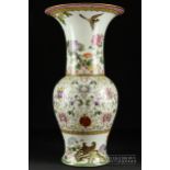 A large Chinese porcelain vase, of bulbous form with wide trumpet neck, finely enamelled with