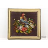 A woolwork picture of a parrot amidst blossoms, framed, 53 x 30cm