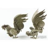 A pair of naturalistically modelled silver plated fighting cocks, c1900, 25cm high max. approx. (2)