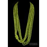A five row faceted peridot bead torsade necklace by Maeva, the 116cm long torsade composed of five