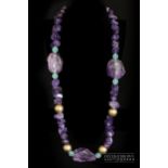 A large amethyst, gilt and faceted chalcedony bead necklace, composed of three large amethyst