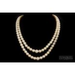 A two row cultured pearl necklace, with tourmaline and diamond clasp, comprising 62 and 66 graduated