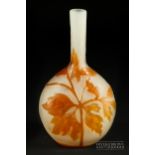 A small Galle cameo glass banjo vase, orange cut through to clear, decorated with a clematis