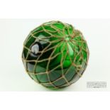A green glass Cornish net float