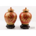 A very fine pair of coral ground gilt decorated Chinese porcelain vases & covers, probably