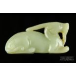 A Chinese celadon jade carved figure of a mythical beast or goat, probably 19th century, 6.5cm