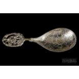 A Continental silver caddy spoon, the handle pierced with St George and the Dragon, stamped import