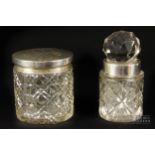 A silver mounted cut glass circular powder box; and a silver mounted toilet jar with cut glass
