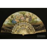 A Victorian fan, the intricately pierced ivory sticks and guards with floral decoration, coloured in