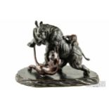 An antique Japanese patinated bronze group of a rhinoceros and two tigers, Meiji Period, 1873-