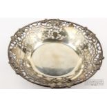 A silver grape basket, circular, pierced and cast with fruiting vines, makers mark PP Ltd.,