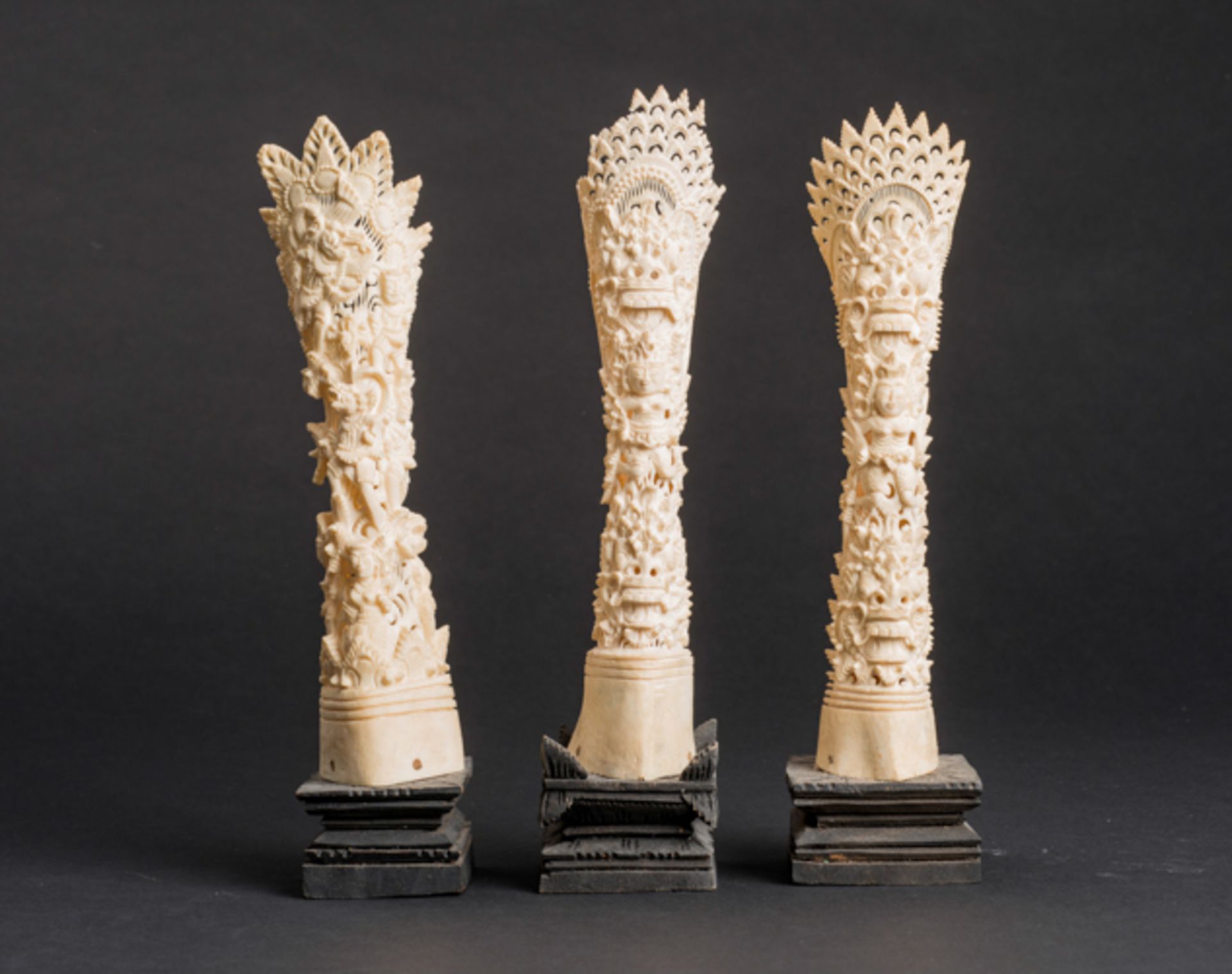 THREE FIGURATIVE ORNAMENTAL CARVINGS  Ivory. Indonesia, 19th - 20th cent.  Two are executed very