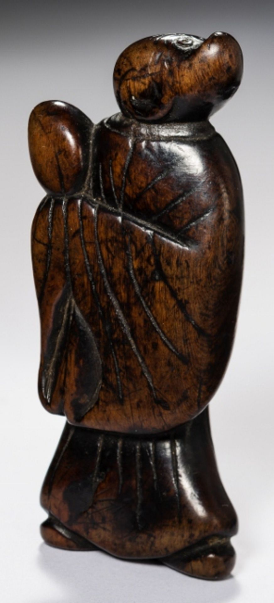 MONKEY SONGOKU WITH PEACH  Netsuke, wood. Japan, 18th cent.  An interesting depiction of the