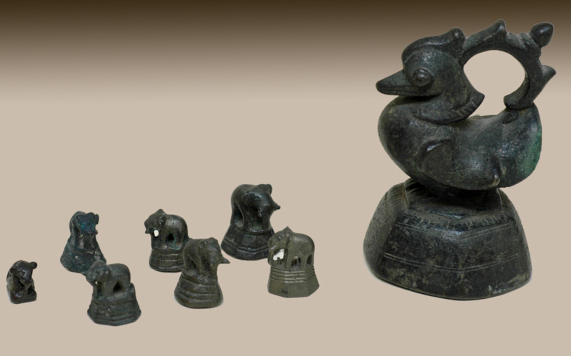 EIGHT ANTIQUE BURMESE WEIGHTS  Bronze, Burma/Myanmar, 19th cent., perhaps older  A group of five