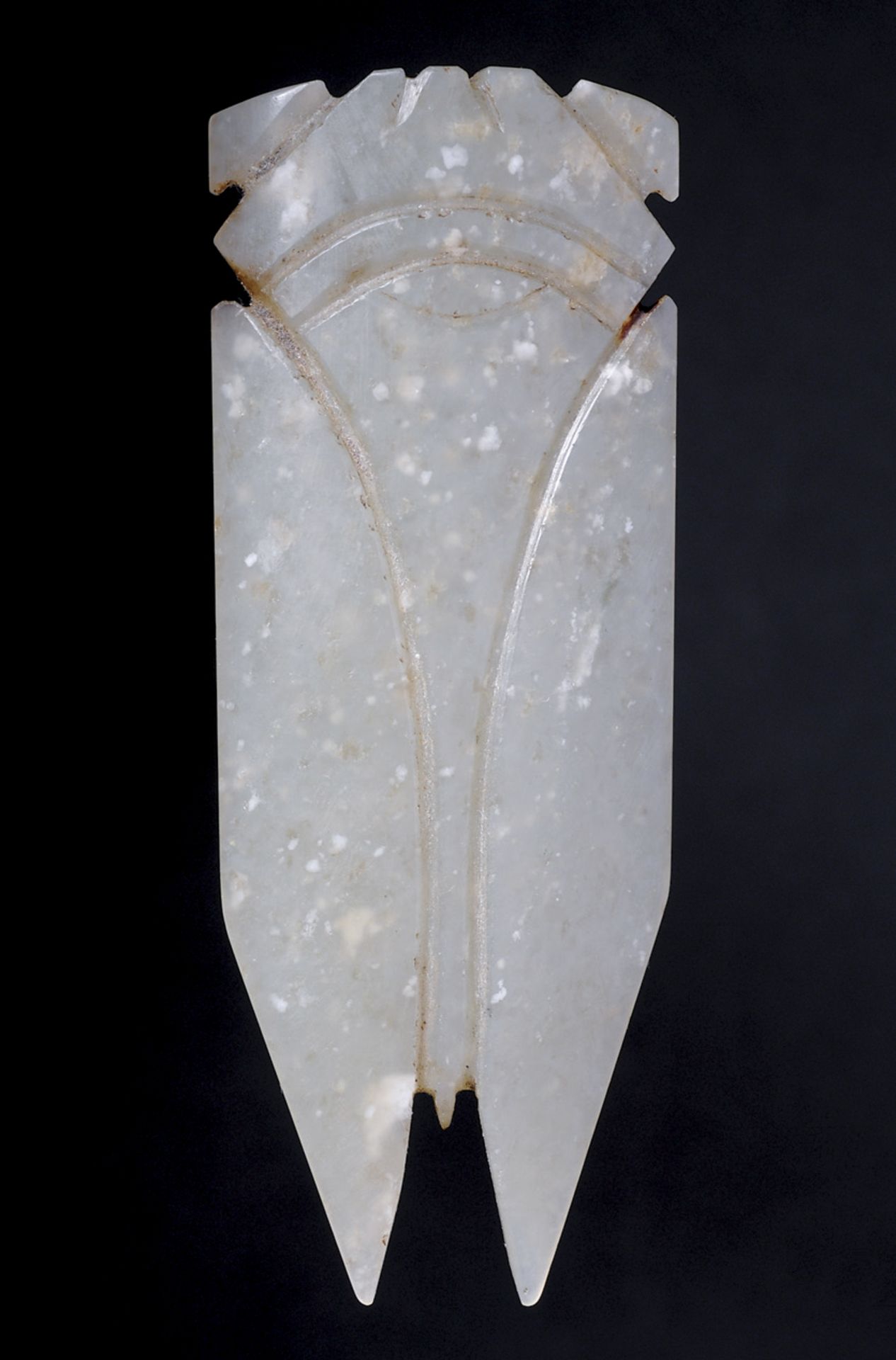 AMULET IN THE SHAPE OF A CICADA  Jade, China, Han period, 206 BC - AD 220  Amulet shaped as stylized