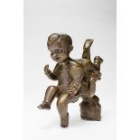 TWO BOYS SYMBOLIZING GOOD FORTUNE  Yellow bronze. China, late Qing – approx. Republic  These two