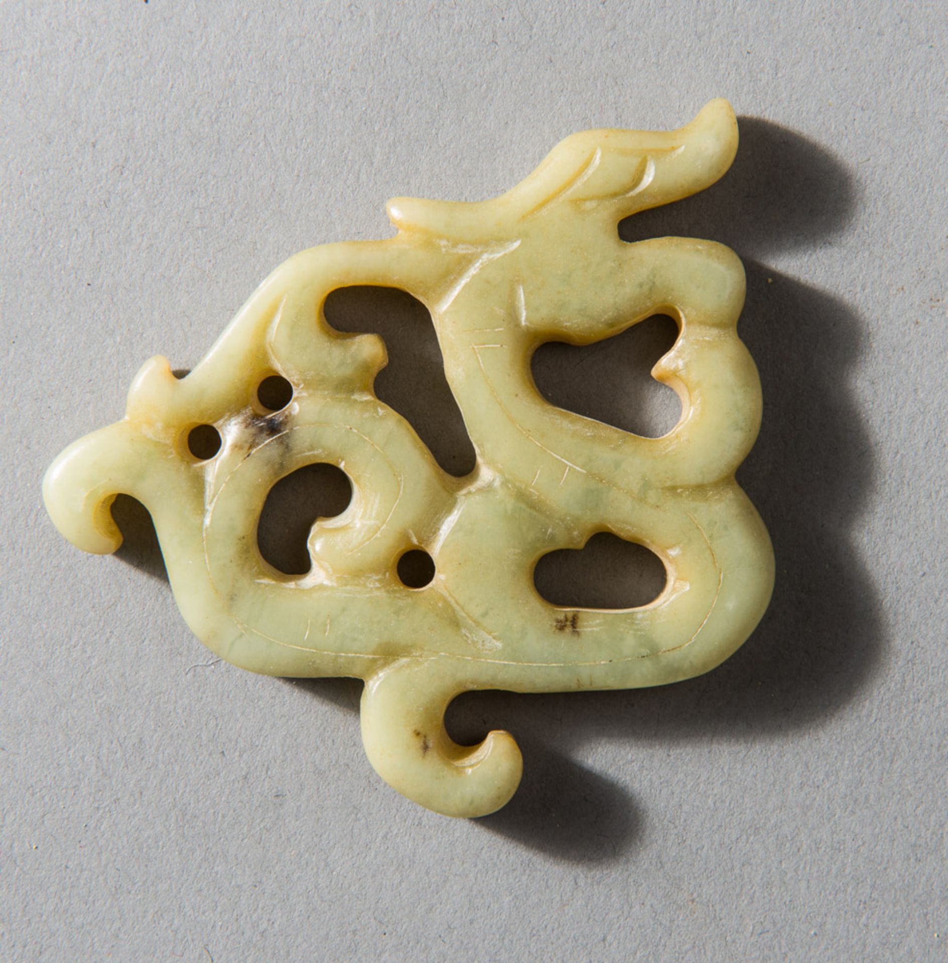 OPENWORK DRAGON AMULET  Jade (Nephrit). China, late Qing, ca 19th cent.  Fine openworked grey