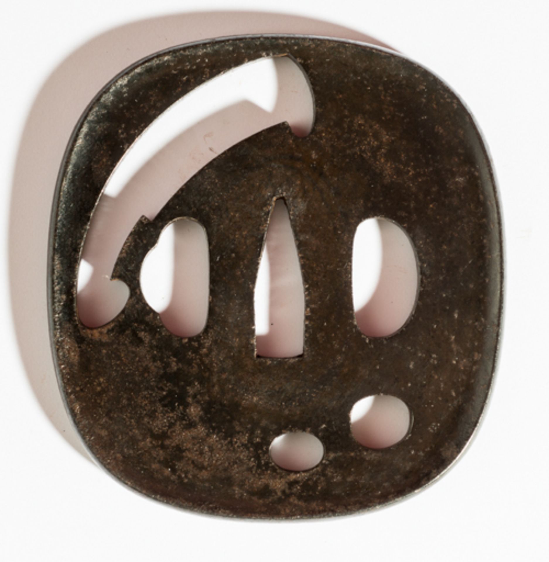 TSUBA WITH CLEAVES NATA  Iron. Japan, 19th cent.  Tsuba rendered in the style of the old ko-