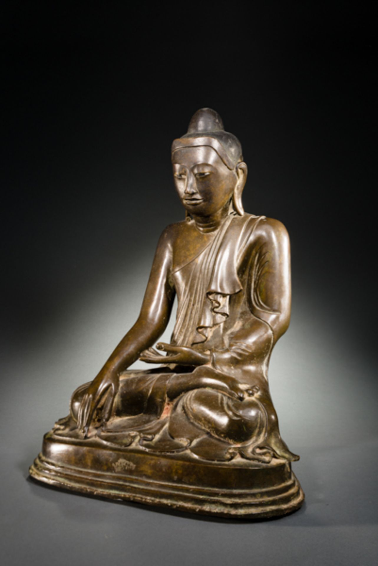 BUDDHA SEATED IN BHUMIAPARSA MUDRA  Bronze. Burma/Myanmar, in the style of Mandalay, 19th cent.  A