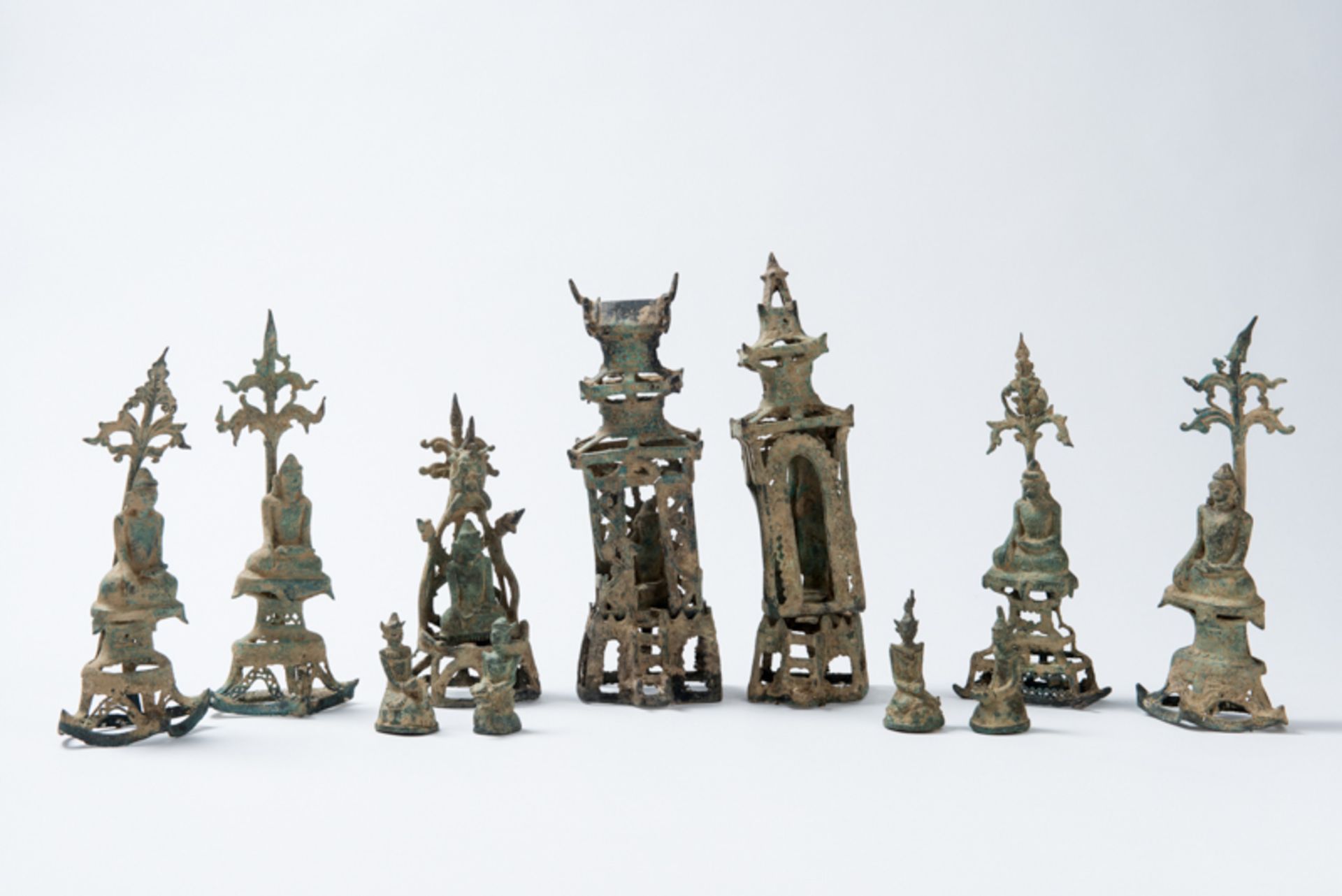 FIGURATIVE ALTAR GROUP INCLUDING BUDDHAS AND ADORANTS  Bronze. Burma/Myanmar, Konbaung Dynasty,