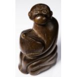 MONKEY WITH FRUIT    Netsuke, wood, Japan, early 19th century. HEIGHT 5,55 CM   The monkey sits on a