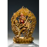 16 ARMED CAKRASAMVARA  Fire gilt bronze. Nepal, 20th cent.  Bronze figure of a four-headed Sadhita