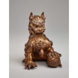 PALACE LION WITH BALL  Bronze with lacquer gilding. China, late Qing dynasty, approx. 19th cent.
