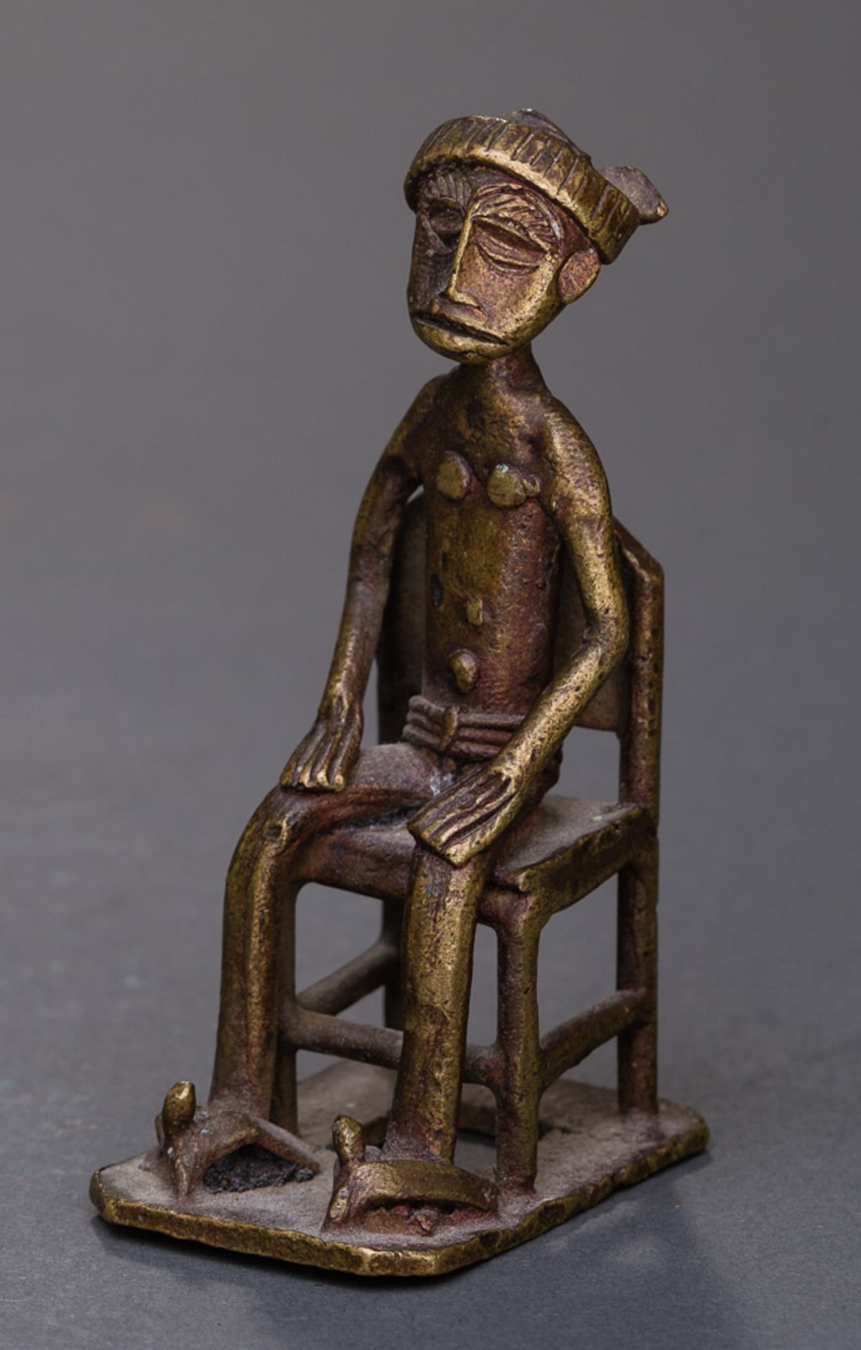 BRONZE FIGURINE  Bronze. India, 19th to 20th cent.  Miniature bronze figurine of an aged man (