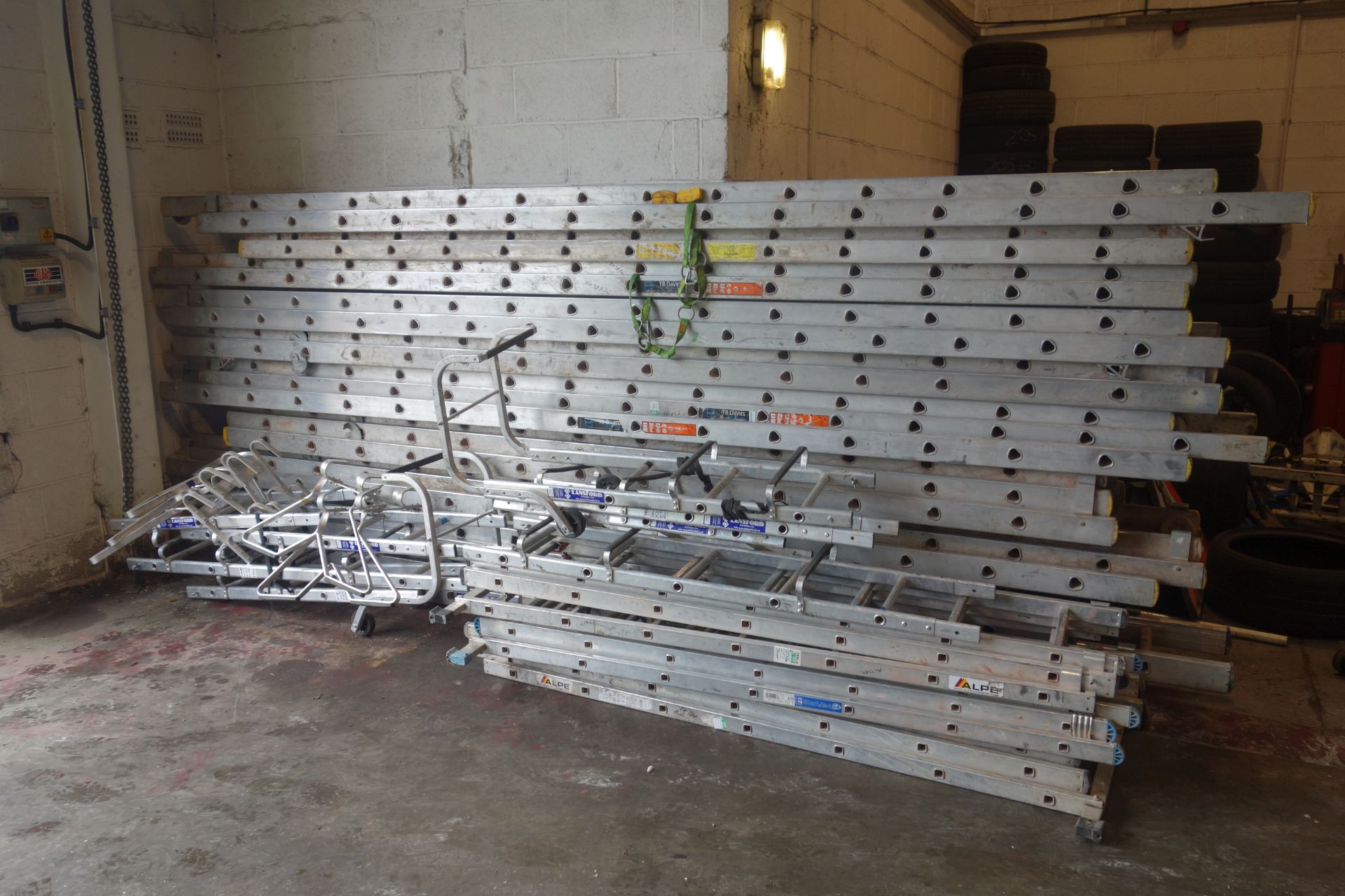 15 ladders as lotted: Four x 4m double extension ladders with wheels (each ladder making 8m in - Image 7 of 7