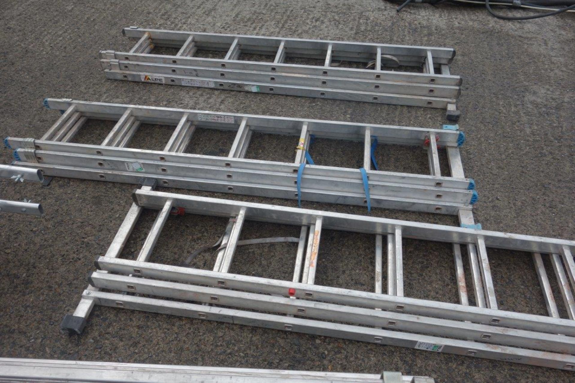 15 ladders as lotted: Four x 4m double extension ladders with wheels (each ladder making 8m in - Image 6 of 7