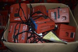 Box of various Hilti battery chargers