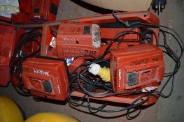 Box of various Hilti battery chargers