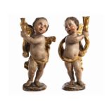 Joseph Deutschmann,1717 - 1787, style of PAIR OF CARVED PUTTI Height: ca. 43 cm. The short, formerly