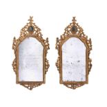 Pair of Baroque mirrors124 x 64 cm. 18th century. Carved giltwood. Restored, with signs of ageing,