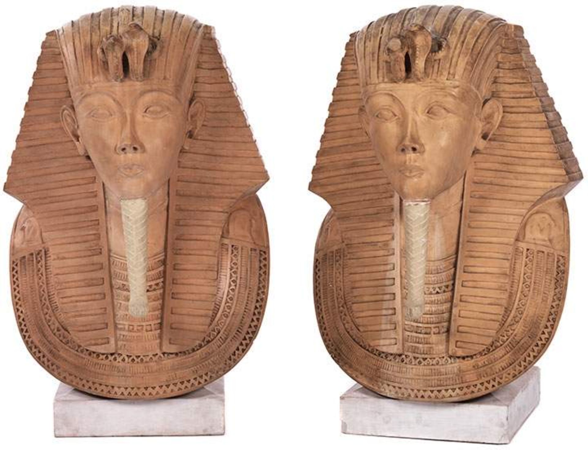 Pair of colossal pharaoh bustsHeight: ca. 90 cm. Ochre-coloured stone and gesso. On base. Damaged