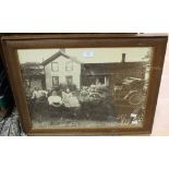 A framed photograph of a family and vint