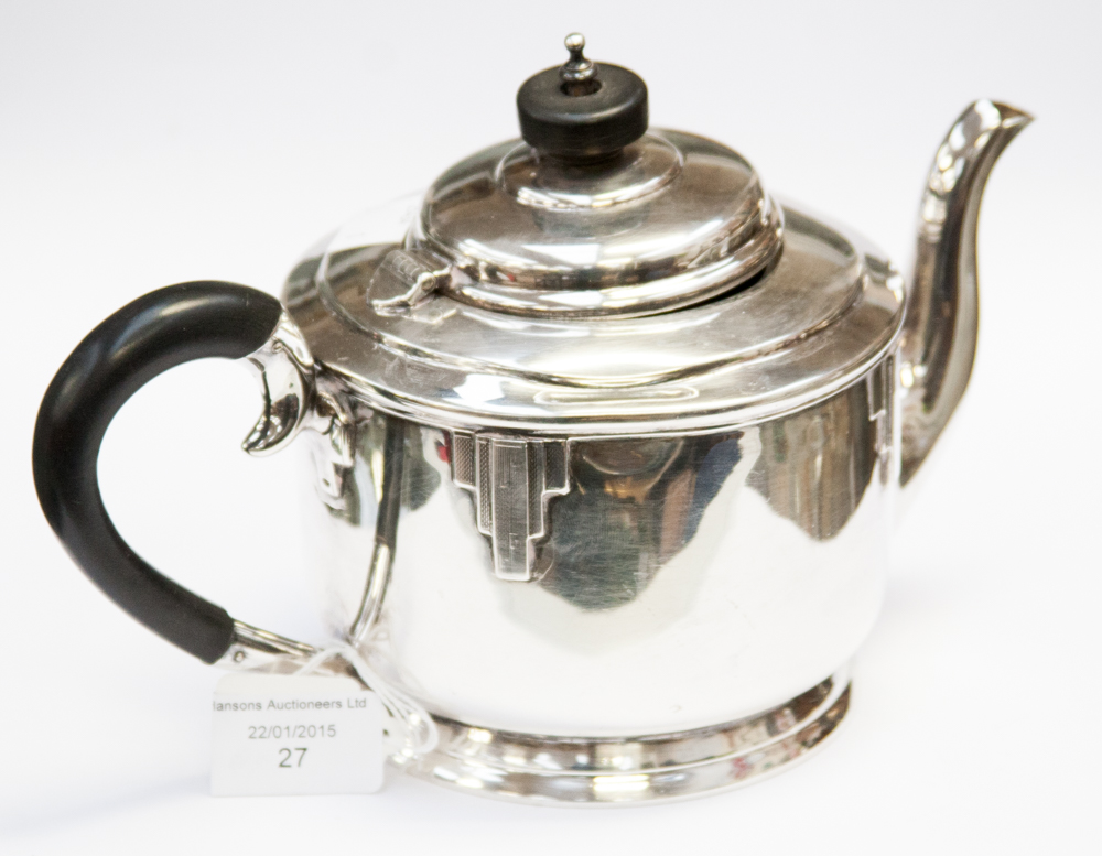 An Art Deco silver teapot, footed cylind