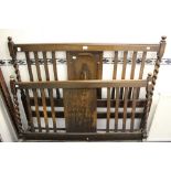 A 1920s oak bedstead, the headboard and