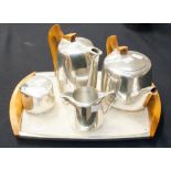 A Piquot ware aluminium five piece tea s