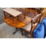 A mahogany extending table, together wit