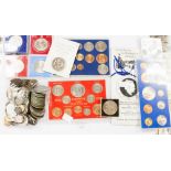 An assortment of mixed coin sets, includ