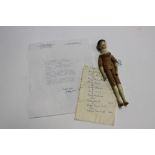 A nine inch approx wooden jointed doll,