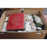 A box of cigarette and trade cards in al