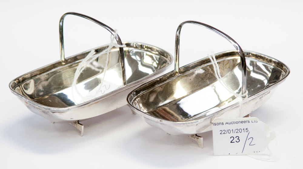 A pair of George V silver baskets in the