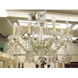 A late 20th Century glass eight-branch chandelier, with lustres